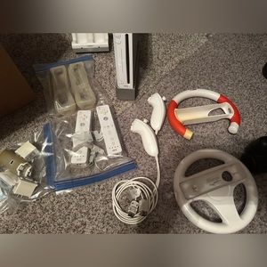 Wii console with several controls and accessories